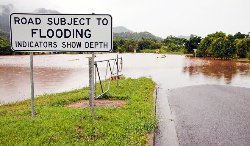 sign signal australia flood disaster rain road street tropics river water