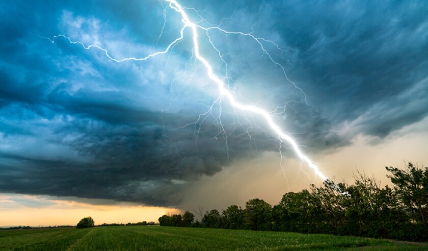 cloud storm sky with thunderbolt over rural landscape